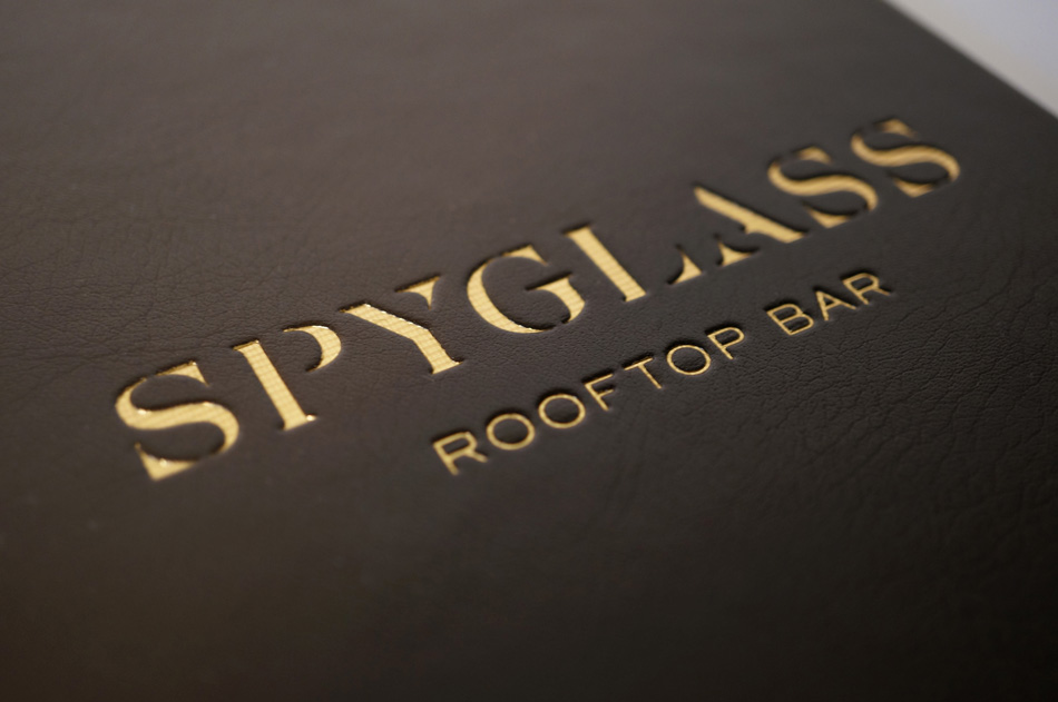 Detail of Spyglass Gold Foil Stamped Leather Menu Cover